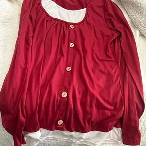 Woman’s simple red top.